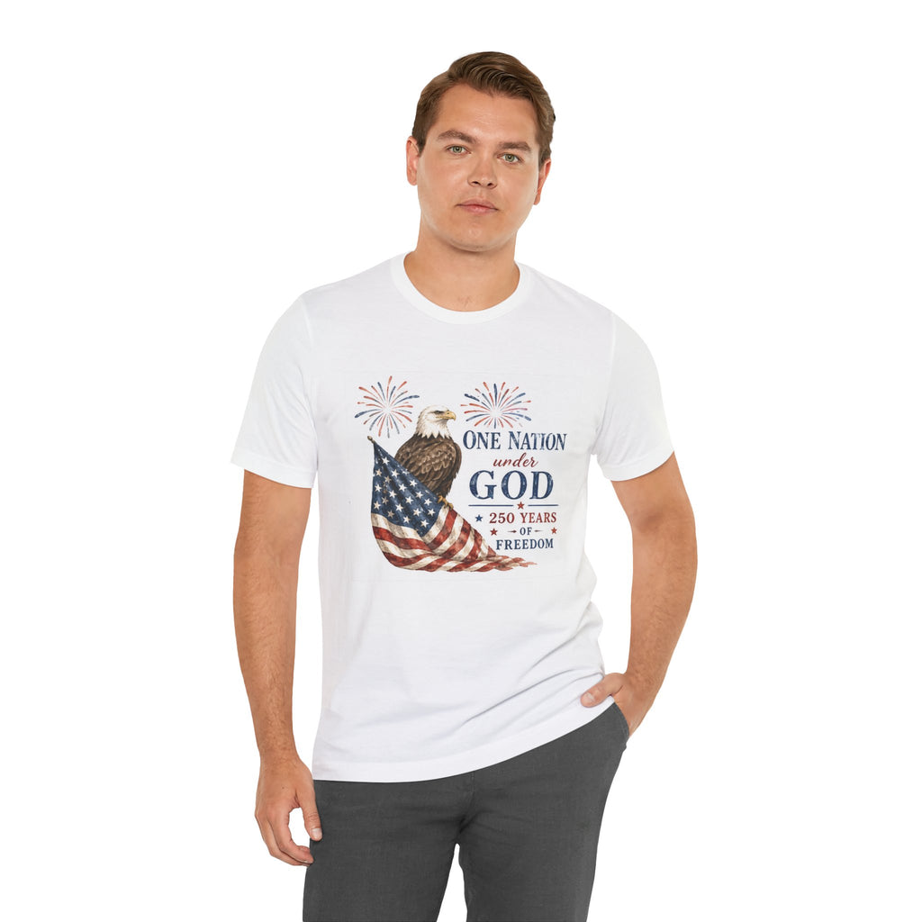 Man in white t-shirt with American flag, eagle, and "One Nation under God" text.