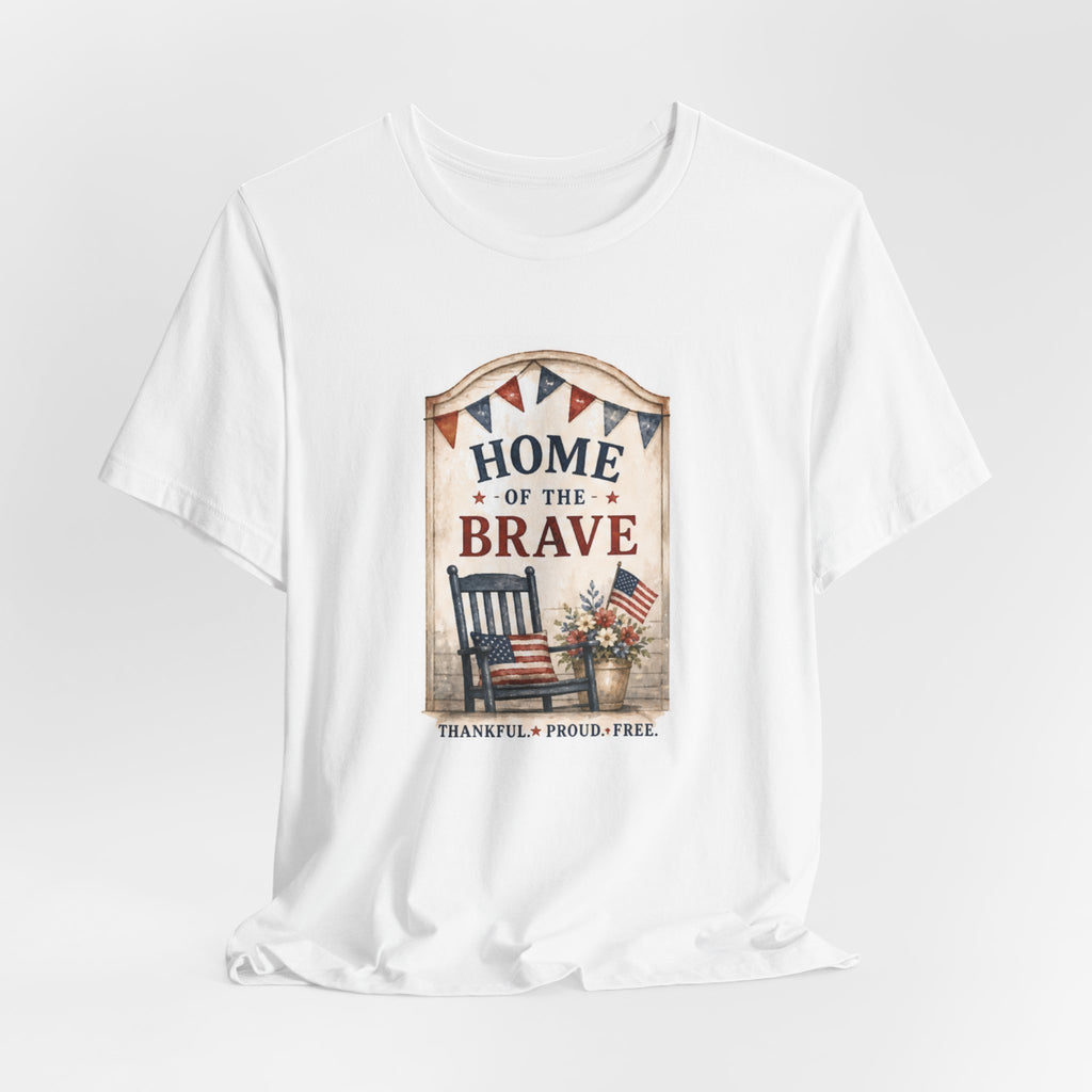 White t-shirt with patriotic "HOME OF THE BRAVE" text and rocking chair graphic.