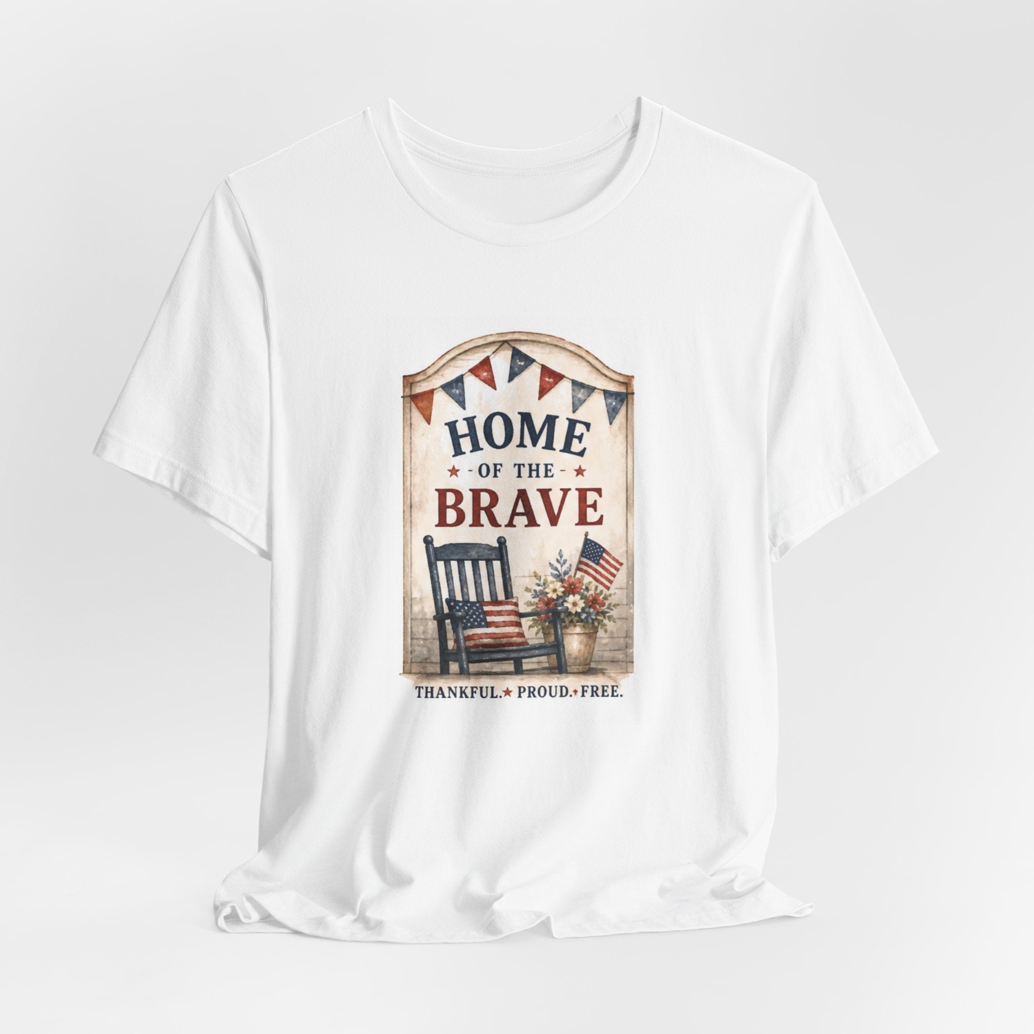 White t-shirt with patriotic "HOME OF THE BRAVE" text and rocking chair graphic.
